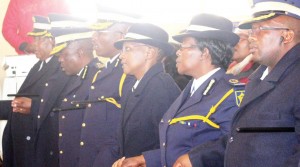 Compol Khothatso Tšooana (fourth from right) and LMPS deputy commissioners hold hands during the prayer service.