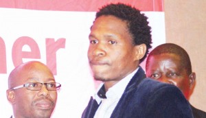 Linare midfielder Mabuti Potloane (centre) receives the Player of the Season award during the Vodacom Premier League awards ceremony held at Lesotho Sun hotel on Wednesday.