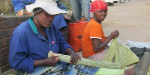 The broom making graft is the only source of living for the unemployed women of Maputsoe - Copy