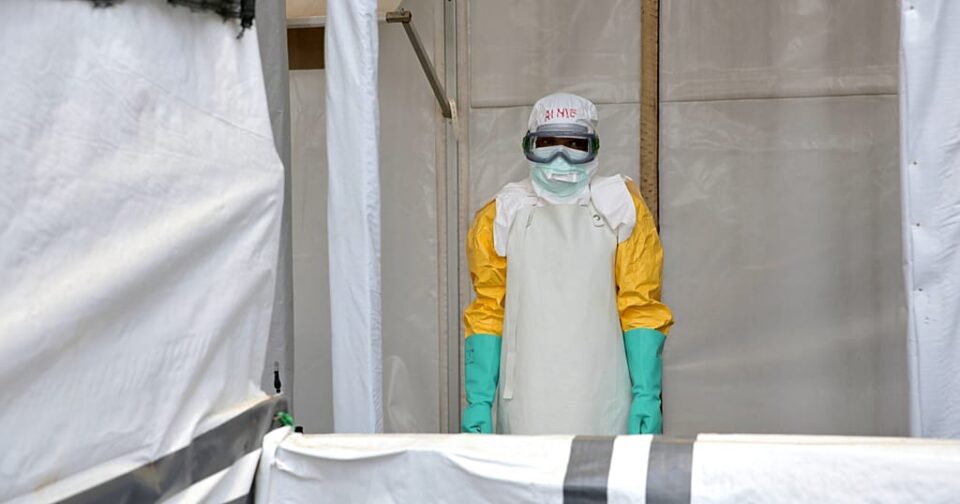 An Ebola health worker in protective clothing takes a break at a treatment centre in Beni, Democratic Republic of Congo, on 31 August 2026