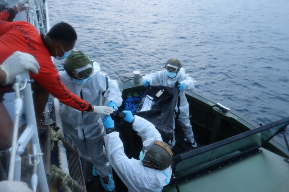 Philippine Coast Guard rescuers transfer remains from the burned MV June Aster ferry off Coron, Palawan, on 11 September 2026
