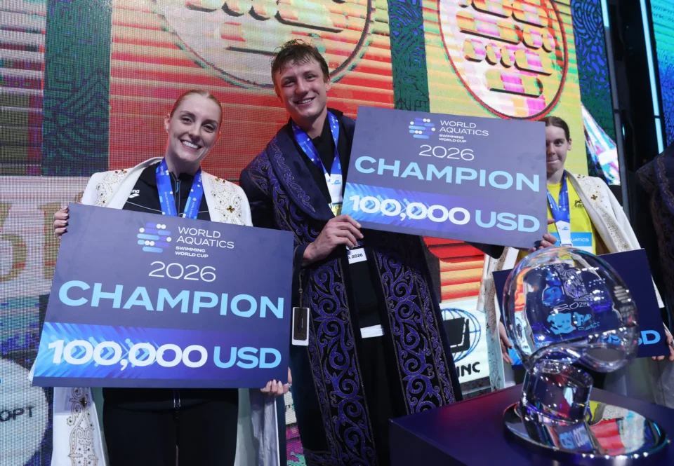 Pieter Coetze of South Africa and Marrit Steenbergen of the Netherlands pose with their overall Swimming World Cup trophies in Astana